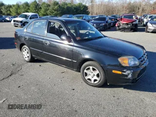 2005 Hyundai Accent GLS with VIN KMHCG45C15U662362, listed as a Copart auction lot 80574774 with 122,898 mi miles and Salvage Title. Bid and sale history available at carsss.com. Image 4.