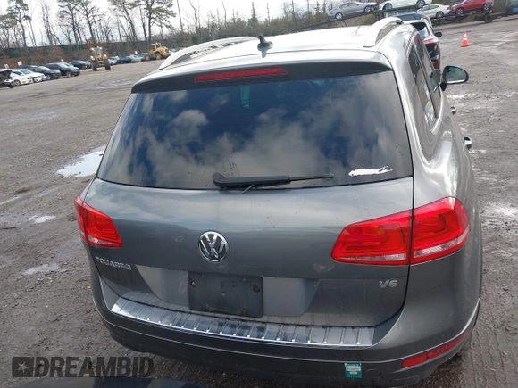 2013 Volkswagen Touareg Lux with VIN WVGEF9BPXDD000679, listed as a IAAI auction lot 41956471 with 117,465 mi miles and . Bid and sale history available at DreamBid. Image 16.