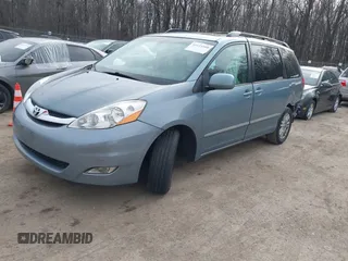 2008 Toyota Sienna XLE with VIN 5TDZK22C18S102498, listed as a IAAI auction lot 41623508 with 214,485 mi miles. Bid and sale history available at carsss.com. Image 2.