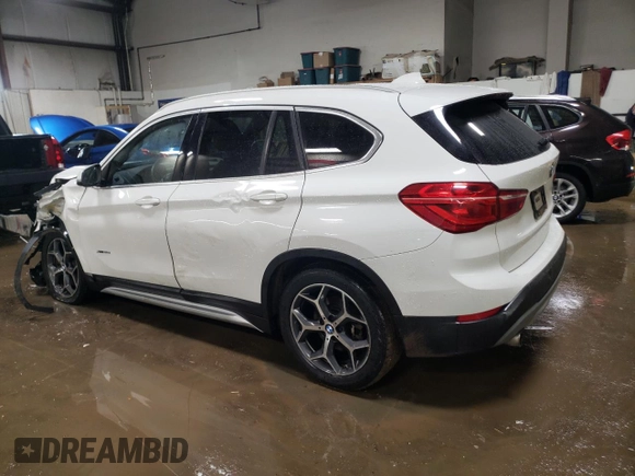 2016 BMW X1 xDrive28i with VIN WBXHT3C3XG5E51117, listed as a Copart auction lot 48243355 with 129,607 mi miles and Salvage Title. Bid and sale history available at carsss.com. Image 2.