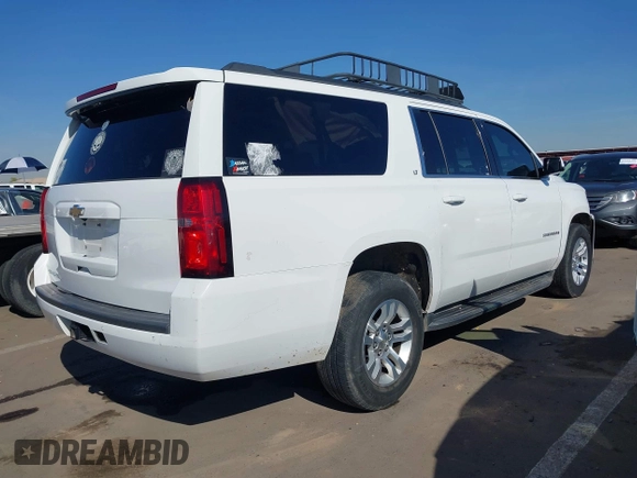 2019 Chevrolet Suburban LT with VIN 1GNSCHKC3KR143942, listed as a IAAI auction lot 41896633 with 153,139 mi miles and . Bid and sale history available at DreamBid. Image 4.