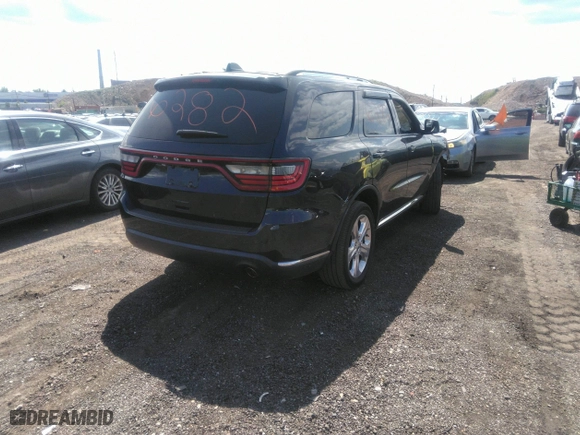 2014 Dodge Durango Limited with VIN 1C4RDJDG3EC585865, listed as a IAAI auction lot 40136282 with 68,046 mi miles. Bid and sale history available at carsss.com. Image 4.