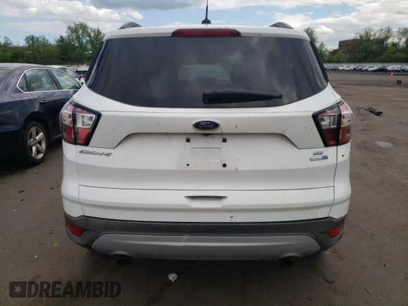 2018 Ford Escape SE z VIN 1FMCU9GDXJUA71940, wystawiony jako Copart lot #55891775 z przebiegiem 117 298 mil mil oraz Tytuł czysty. Historia ofert i sprzedaży dostępna na DreamBid. Obrazek 6.