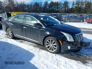 2013 Cadillac XTS Luxury with VIN 2G61R5S31D9106650, listed as a IAAI auction lot 41405091 with 143,545 mi miles. Bid and sale history available at carsss.com. Image 1.