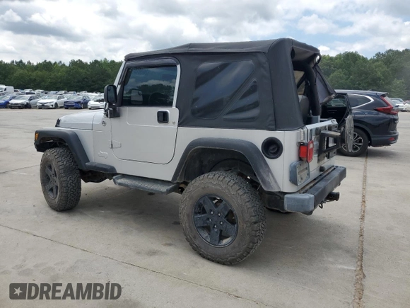 2005 Jeep Wrangler X with VIN 1J4FA39S55P353789, listed as a Copart auction lot 62469015 with 143,817 mi miles and Salvage title. Bid and sale history available at DreamBid. Image 2.
