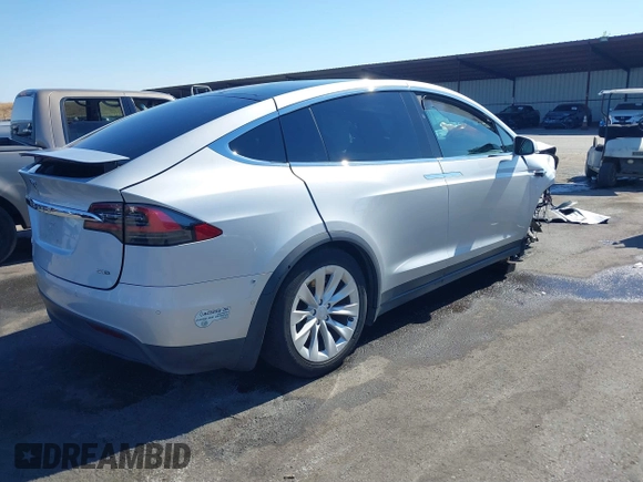 2016 Tesla Model X 70D with VIN 5YJXCAE21GF033123, listed as a IAAI auction lot 39813497 with 162,509 mi miles and . Bid and sale history available at DreamBid. Image 4.