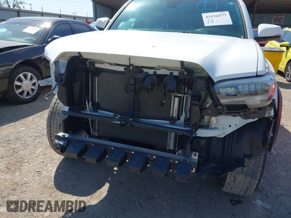 2023 Toyota Tacoma SR z VIN 3TYCZ5AN5PT151681, wystawiony jako IAAI lot #41936577 z przebiegiem 30 056 mil mil oraz . Historia ofert i sprzedaży dostępna na DreamBid. Obrazek 6.