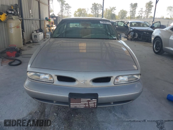 1998 Oldsmobile 88 LS z VIN 1G3HN52K4W4803377, wystawiony jako Copart lot #75638114 z przebiegiem 75 754 mil mil oraz Tytuł czysty. Historia ofert i sprzedaży dostępna na DreamBid. Obrazek 5.