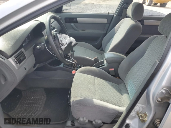 2006 Suzuki Forenza z VIN KL5JD56Z96K362651, wystawiony jako Copart lot #78306894 z przebiegiem 167 916 mil mil oraz Tytuł czysty. Historia ofert i sprzedaży dostępna na DreamBid. Obrazek 7.