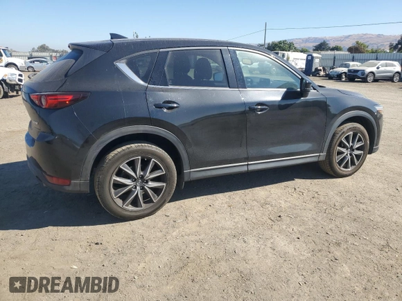 2018 Mazda CX-5 Grand Touring с VIN JM3KFADM2J1310339, выставлен на аукционе Copart как лот 64705245 с пробегом 63 927 миль миль и Списание • Salvage title. История ставок и продаж доступна на DreamBid. Изображение 3.