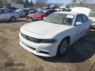 2021 Dodge Charger SXT with VIN 2C3CDXBG5MH605867, listed as a IAAI auction lot 41682336 with 56,660 mi miles and . Bid and sale history available at DreamBid. Image 2.