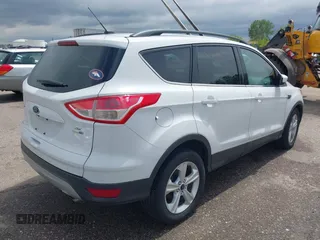 2014 Ford Escape SE with VIN 1FMCU9GX6EUD51032, listed as a IAAI auction lot 42206659 with 131,438 mi miles and . Bid and sale history available at DreamBid. Image 4.