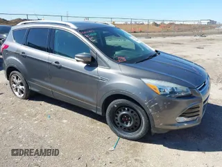2014 Ford Escape Titanium with VIN 1FMCU9J9XEUA90305, listed as a IAAI auction lot 41724436 with 165,518 mi miles. Bid and sale history available at carsss.com. Image 1.