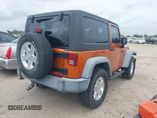 2011 Jeep Wrangler Sport with VIN 1J4AA2D1XBL579882, listed as a IAAI auction lot 42122353 with 153,885 mi miles and . Bid and sale history available at carsss.com. Image 4.