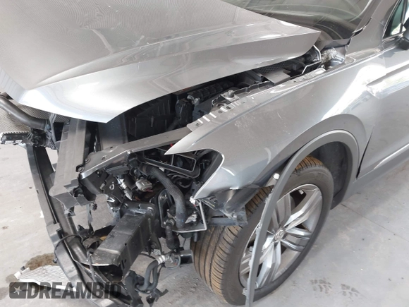 2020 Volkswagen Tiguan SE z VIN 3VV3B7AX0LM007612, wystawiony jako IAAI lot #42275320 z przebiegiem 44 254 mil mil oraz . Historia ofert i sprzedaży dostępna na DreamBid. Obrazek 6.