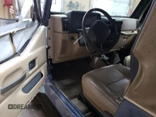 2000 Jeep Wrangler SE with VIN 1J4FA29P1YP739555, listed as a Copart auction lot 58501025 with 128,458 mi miles and Clean title. Bid and sale history available at DreamBid. Image 8.