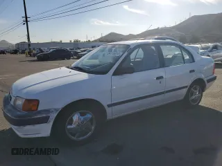 1997 Toyota Tercel DX z VIN JT2BC52L6V0247754, wystawiony jako Copart lot #84116054 z przebiegiem 262 749 mil mil oraz Szkoda całkowita • Salvage title. Historia ofert i sprzedaży dostępna na DreamBid. Obrazek 1.