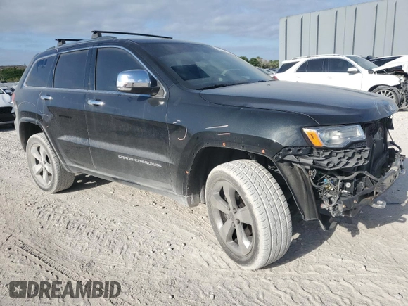 2015 Jeep Grand Cherokee Overland with VIN 1C4RJFCG6FC919637, listed as a Copart auction lot 52072925 with 111,552 mi miles and Salvage Title. Bid and sale history available at carsss.com. Image 4.