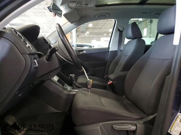2013 Volkswagen Tiguan SE with VIN WVGBV7AX4DW518545, listed as a Copart auction lot 64585175 with 104,030 mi miles and Salvage title. Bid and sale history available at DreamBid. Image 7.
