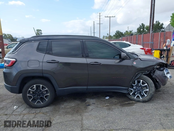 2021 Jeep Compass Trailhawk with VIN 3C4NJDDB6MT561074, listed as a IAAI auction lot 42125886 with 77,293 mi miles and . Bid and sale history available at DreamBid. Image 14.