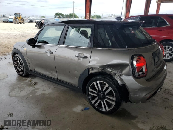 2021 MINI Hardtop 4 Door Cooper S with VIN WMWXU9C0XM2M90621, listed as a Copart auction lot 52513635 with 57,419 mi miles and Salvage title. Bid and sale history available at DreamBid. Image 2.
