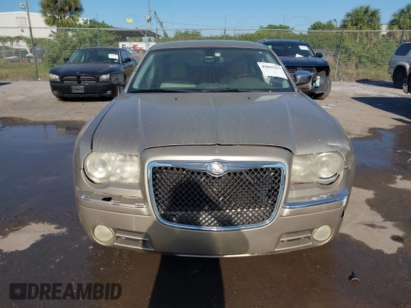 2009 Chrysler 300 Limited with VIN 2C3KA33V99H592963, listed as a IAAI auction lot 42041417 with 160,829 mi miles. Bid and sale history available at carsss.com. Image 6.