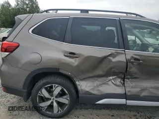 2021 Subaru Forester Touring z VIN JF2SKAXC0MH560263, wystawiony jako Copart lot #61453195 z przebiegiem Nie podano mil oraz Szkoda całkowita • Salvage title. Historia ofert i sprzedaży dostępna na DreamBid. Obrazek 11.