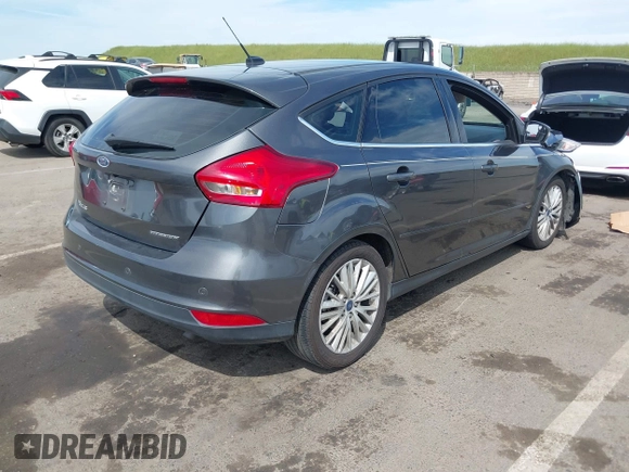 2018 Ford Focus Titanium with VIN 1FADP3N23JL241453, listed as a IAAI auction lot 42025190 with 90,174 mi miles and . Bid and sale history available at DreamBid. Image 4.
