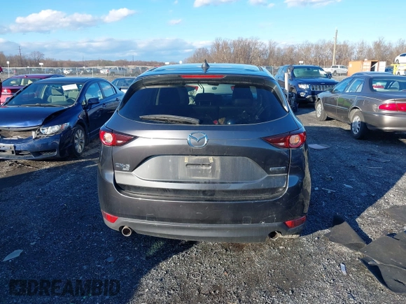 2021 Mazda CX-5 Touring with VIN JM3KFBCM8M1370640, listed as a IAAI auction lot 41207736 with 57,570 mi miles. Bid and sale history available at carsss.com. Image 17.