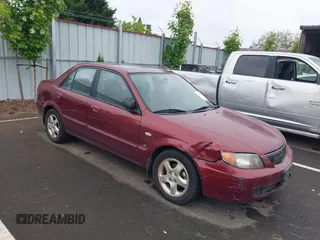 2002 Mazda Protege DX z VIN JM1BJ225320638935, wystawiony jako IAAI lot #42297239 z przebiegiem 178 612 mil mil oraz . Historia ofert i sprzedaży dostępna na DreamBid. Obrazek 1.