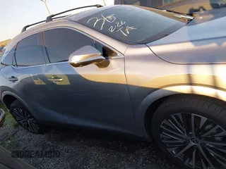 2024 Lexus RX 350h z VIN 2T2BBMCAXRC036064, wystawiony jako IAAI lot #41344207 z przebiegiem 9389 mil mil oraz . Historia ofert i sprzedaży dostępna na DreamBid. Obrazek 14.