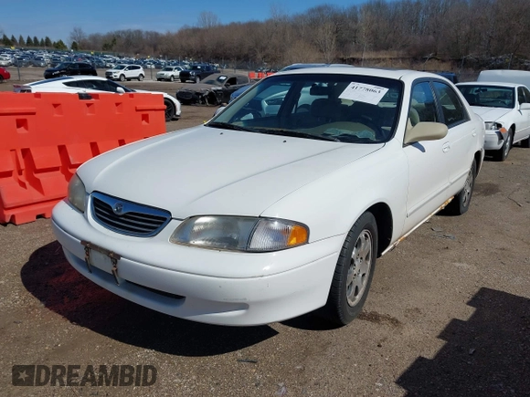 1998 Mazda 626 DX z VIN 1YVGF22CXW5702980, wystawiony jako IAAI lot #41778063 z przebiegiem 104 672 mil mil oraz . Historia ofert i sprzedaży dostępna na DreamBid. Obrazek 2.
