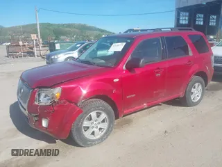 2008 Mercury Mariner z VIN 4M2CU91148KJ41869, wystawiony jako IAAI lot #42140773 z przebiegiem 235 055 mil mil oraz . Historia ofert i sprzedaży dostępna na DreamBid. Obrazek 2.