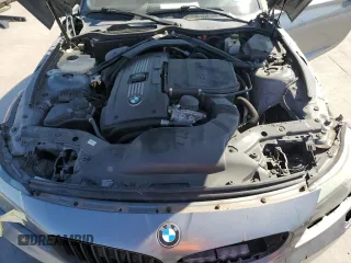 2011 BMW Z4 sDrive35i with VIN WBALM7C59BE384283, listed as a Copart auction lot 77204914 with 87,016 mi miles and Salvage Title. Bid and sale history available at carsss.com. Image 11.