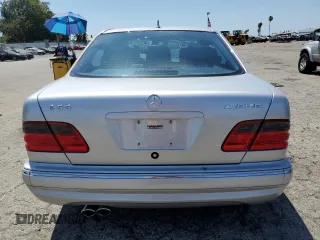 2000 Mercedes-Benz E with VIN WDBJF74J7YB055624, listed as a Copart auction lot 63880184 with 71,355 mi miles and Salvage Title. Bid and sale history available at DreamBid. Image 6.