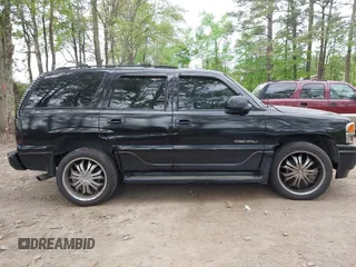 2005 GMC Yukon Denali z VIN 1GKEK63U65J182925, wystawiony jako IAAI lot #42071053 z przebiegiem 235 367 mil mil oraz . Historia ofert i sprzedaży dostępna na DreamBid. Obrazek 13.