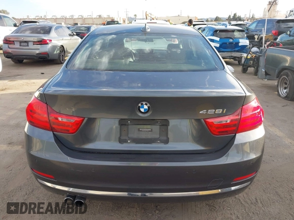 2014 BMW 4 Series 428i with VIN WBA3N7C5XEF719384, listed as a IAAI auction lot 41694678 with 115,517 mi miles and . Bid and sale history available at carsss.com. Image 16.
