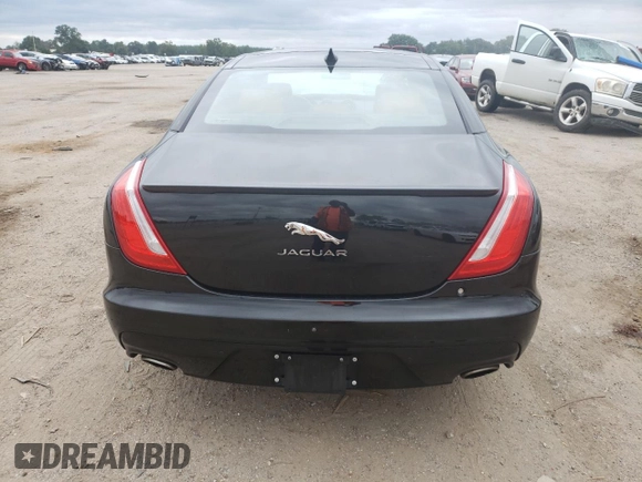 2017 Jaguar XJ with VIN SAJWA1C73H8W10544, listed as a Copart auction lot 70025724 with 64,437 mi miles and Salvage Title. Bid and sale history available at carsss.com. Image 6.