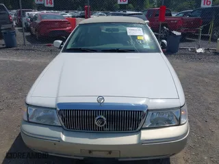 2004 Mercury Grand Marquis GS with VIN 2MEFM74W44X673224, listed as a IAAI auction lot 40670734 with 83,219 mi miles. Bid and sale history available at carsss.com. Image 6.