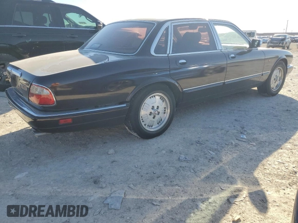 1995 Jaguar XJ with VIN SAJKX1743SC734007, listed as a Copart auction lot 46340825 with 130,115 mi miles and Salvage Title. Bid and sale history available at DreamBid. Image 3.