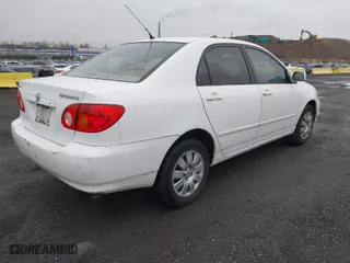 2004 Toyota Corolla CE with VIN 1NXBR32E34Z335238, listed as a IAAI auction lot 41987476 with 124,999 mi miles. Bid and sale history available at carsss.com. Image 4.