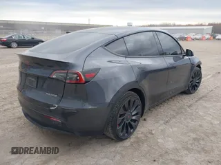 2023 Tesla Model Y Performance with VIN 7SAYGDEF2PF757113, listed as a IAAI auction lot 41881175 with 54,809 mi miles and . Bid and sale history available at DreamBid. Image 4.