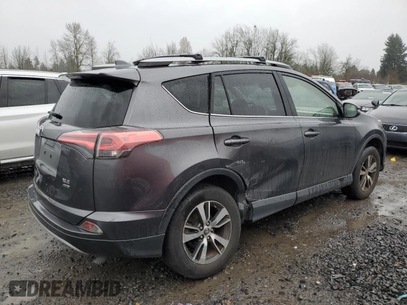 2018 Toyota RAV4 XLE with VIN JTMRFREV0JJ200337, listed as a Copart auction lot 84901594 with 57,301 mi miles and Salvage Title. Bid and sale history available at DreamBid. Image 3.