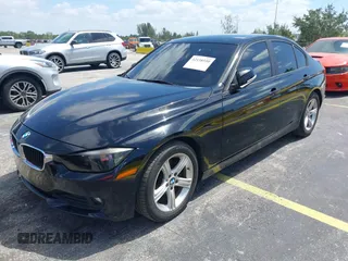 2014 BMW 3 Series 320i with VIN WBA3B1C55EK135357, listed as a IAAI auction lot 42158550 with 148,911 mi miles. Bid and sale history available at carsss.com. Image 2.