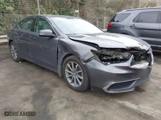 2019 Acura TLX with VIN 19UUB1F36KA004085, listed as a IAAI auction lot 41664344 with 115,125 mi miles. Bid and sale history available at carsss.com. Image 1.