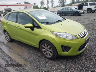2012 Ford Fiesta SE z VIN 3FADP4BJ7CM101862, wystawiony jako IAAI lot #42382441 z przebiegiem 139 214 mil mil oraz . Historia ofert i sprzedaży dostępna na DreamBid. Obrazek 1.