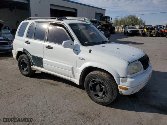 2002 Suzuki Grand Vitara JLX with VIN JS3TD62V824154031, listed as a Copart auction lot 76403684 with 208,529 mi miles and Salvage Title. Bid and sale history available at carsss.com. Image 4.