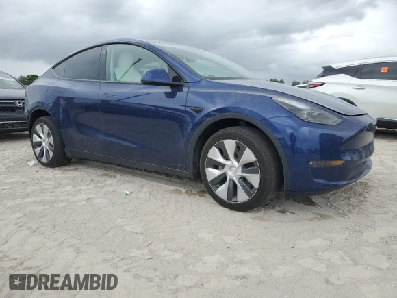 2023 Tesla Model Y Long Range z VIN 7SAYGDEE5PF787794, wystawiony jako Copart lot #55212605 z przebiegiem 30 277 mil mil oraz Szkoda całkowita • Salvage title. Historia ofert i sprzedaży dostępna na DreamBid. Obrazek 4.
