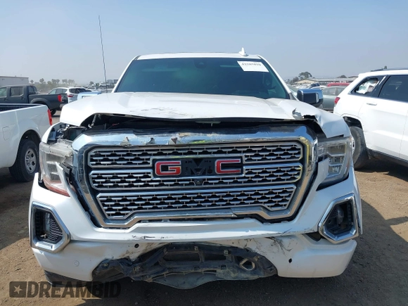 2021 GMC Sierra 1500 Denali z VIN 3GTU9FEL1MG349215, wystawiony jako IAAI lot #42585810 z przebiegiem 97 465 mil mil oraz . Historia ofert i sprzedaży dostępna na DreamBid. Obrazek 6.