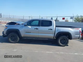 2021 Toyota Tacoma SR with VIN 5TFCZ5AN6MX270972, listed as a IAAI auction lot 42460823 with 76,062 mi miles and . Bid and sale history available at DreamBid. Image 15.